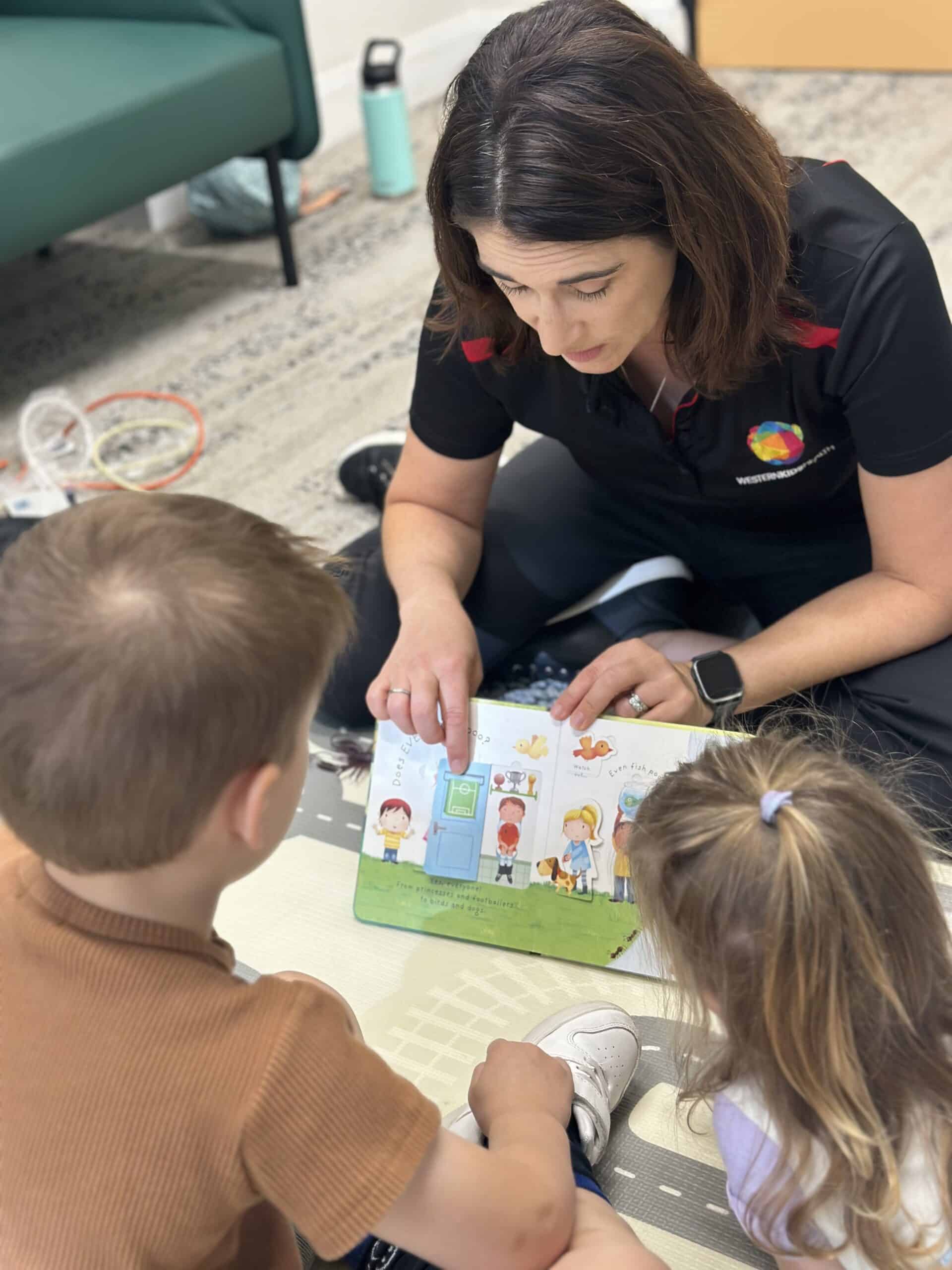 kids reading a book about toilet training
